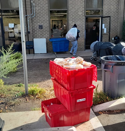 Carrying donated food into Rockville Men's Shelter